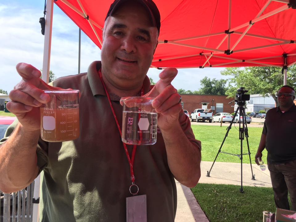 Dr. Victor Medina showcases the before and after results of his PFAS filtration system.
